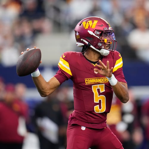 Washington Commanders quarterback Jayden Daniels (5) looks to pass against the Dallas Cowboys during the first half of an NFL football game Sunday, Oct. 19, 2025, in Arlington, Texas. (AP Photo/Jeffrey McWhorter)