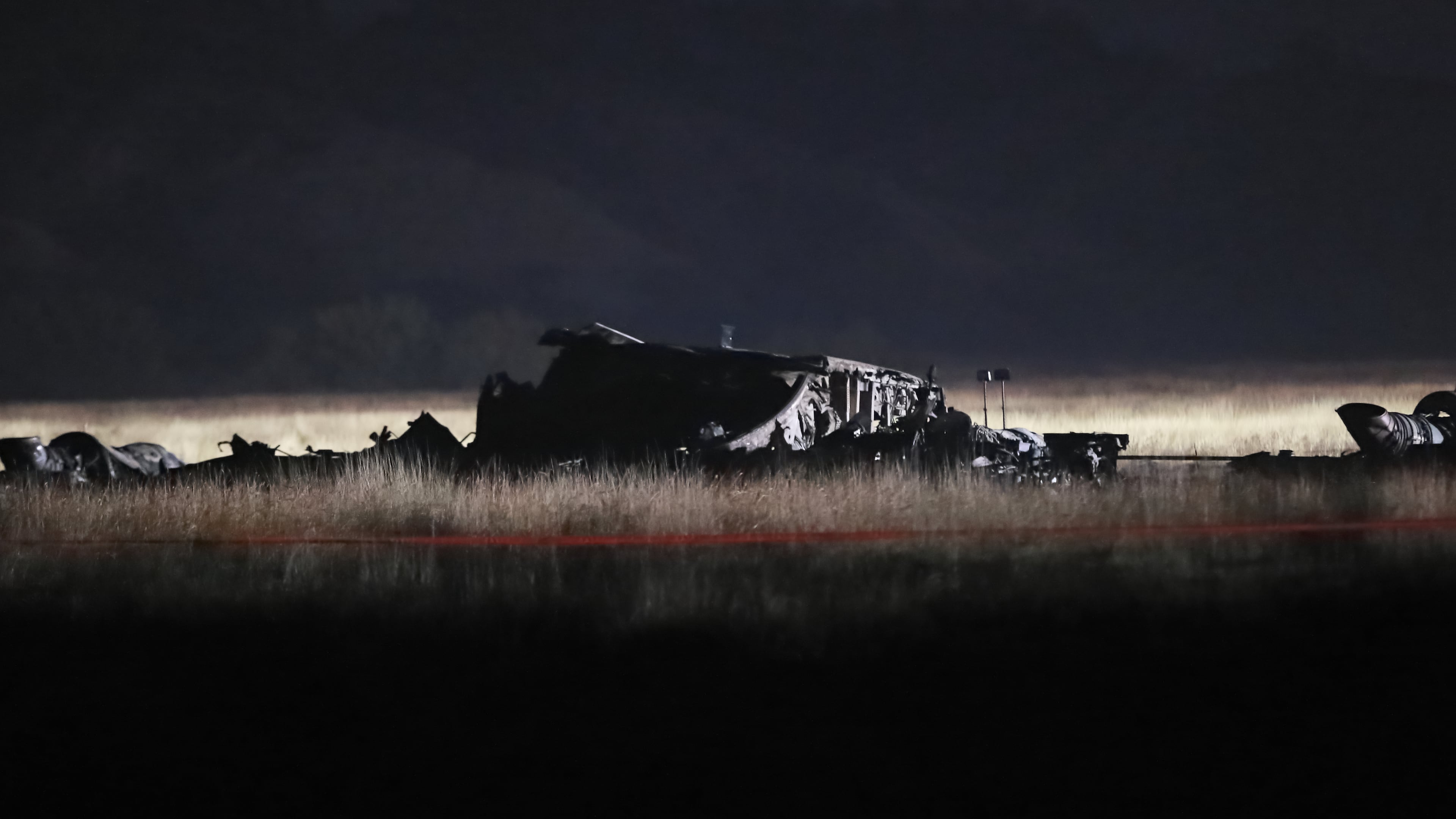 Debris is seen at a crash site of a Turkish military cargo plane in Georgia's Sighnaghi municipality, close to the Azerbaijani border on Wednesday, Nov. 12, 2025. (AP Photo/Zurab Tsertsvadze)