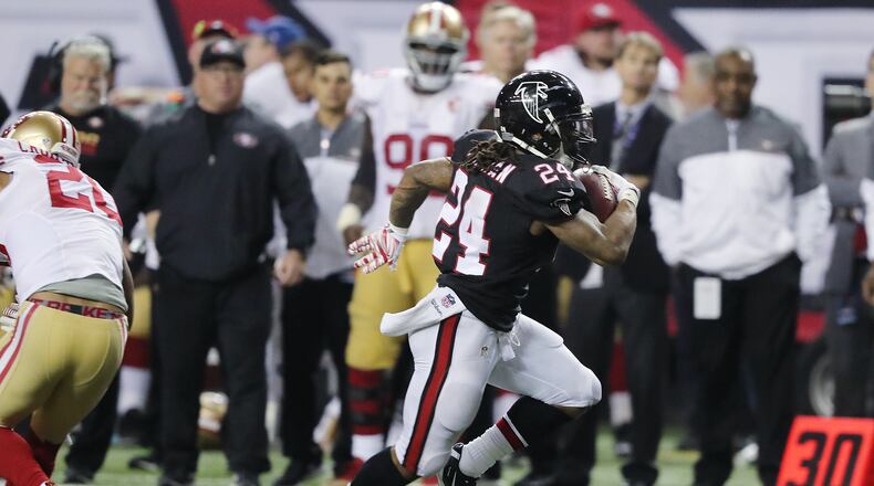 Devonta Freeman breaks through the defense for a long touchdown run against the 49ers.