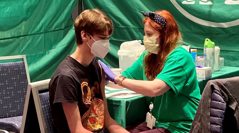 A 17-year-old Children’s Healthcare of Atlanta patient received his Pfizer vaccine from a Children’s nurse at the mass vaccination clinic at the Georgia International Convention Center. 
CONTRIBUTED