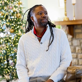Kevin Dunn, shown here in the lobby of Wellstar West Georgia Hospice in LaGrange, said he was called by God to volunteer his time singing for patients and their loved ones. (Miguel Martinez/AJC)