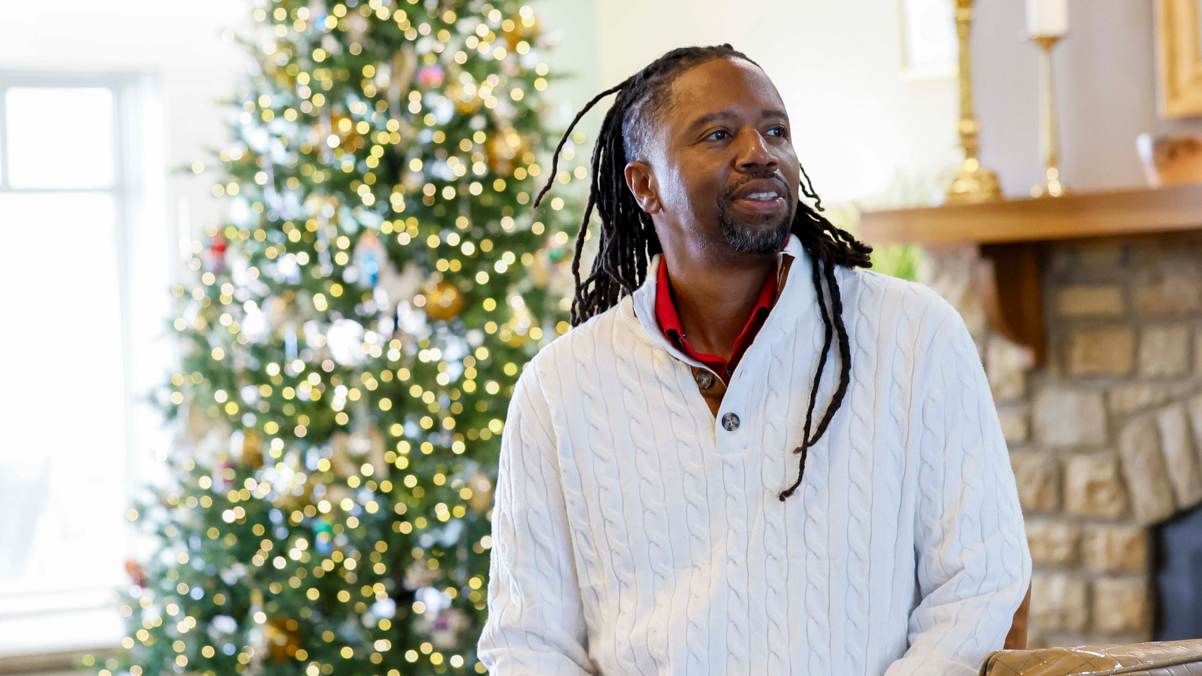 Kevin Dunn, shown here in the lobby of Wellstar West Georgia Hospice in LaGrange, said he was called by God to volunteer his time singing for patients and their loved ones. (Miguel Martinez/AJC)