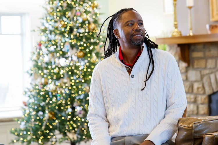 Kevin Dunn, shown here in the lobby of Wellstar West Georgia Hospice in LaGrange, said he was called by God to volunteer his time singing for patients and their loved ones. (Miguel Martinez/AJC)