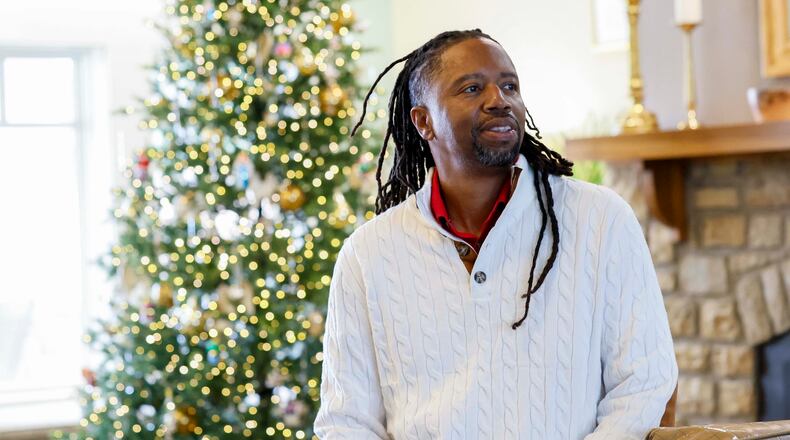 Kevin Dunn, shown here in the lobby of Wellstar West Georgia Hospice in LaGrange, said he was called by God to volunteer his time singing for patients and their loved ones. (Miguel Martinez/AJC)