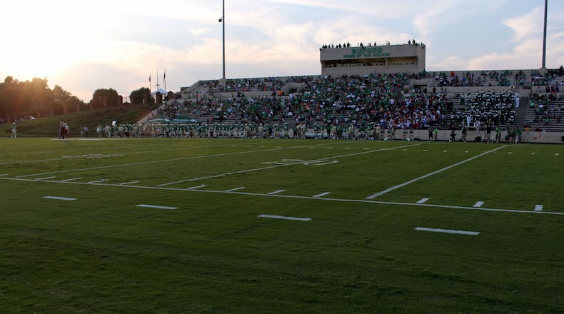 Buford High School football fans cheer in the stadium during Buford's game against Jonesboro High School on Friday, Aug. 25, 2019.