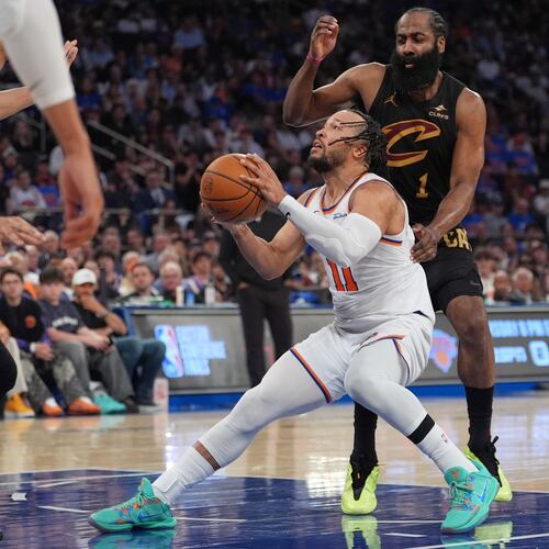 New York Knicks' Jalen Brunson, bottom, drives past Cleveland Cavaliers' James Harden during the second half of Game 1 in the Eastern Conference finals NBA basketball playoffs series Tuesday, May 19, 2026, in New York. (AP Photo/Seth Wenig)