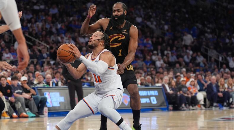 New York Knicks' Jalen Brunson, bottom, drives past Cleveland Cavaliers' James Harden during the second half of Game 1 in the Eastern Conference finals NBA basketball playoffs series Tuesday, May 19, 2026, in New York. (AP Photo/Seth Wenig)