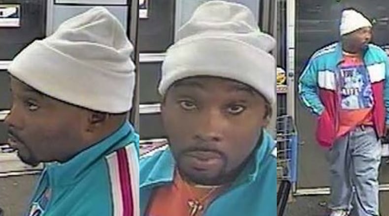 Dunwoody police are searching for this man, who is accused of robbing a Dunwoody High student and his friend at gunpoint.