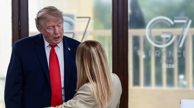 President Donald Trump speaks with Italian Prime Minister Giorgia Meloni at a working lunch with leaders of G7 and the Middle East in Evian-les-Bains, France, Tuesday, June 16, 2026. (Evelyn Hockstein/Pool Photo via AP)