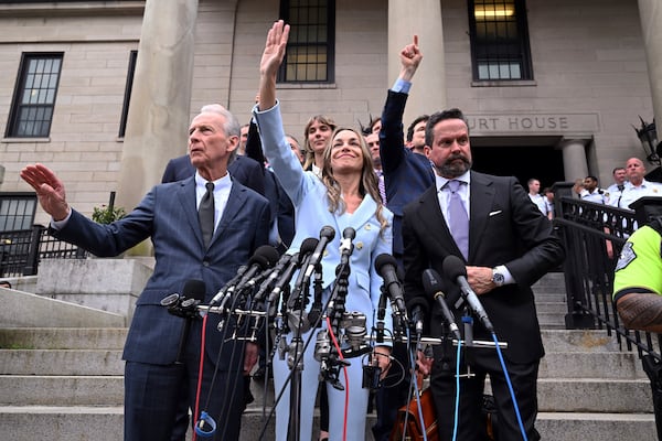 Karen Read, center, waves to supporters after she was found not guilty of second-degree murder on Wednesday, June 18, 2025, in Dedham, Mass. (AP Photo/Josh Reynolds)
