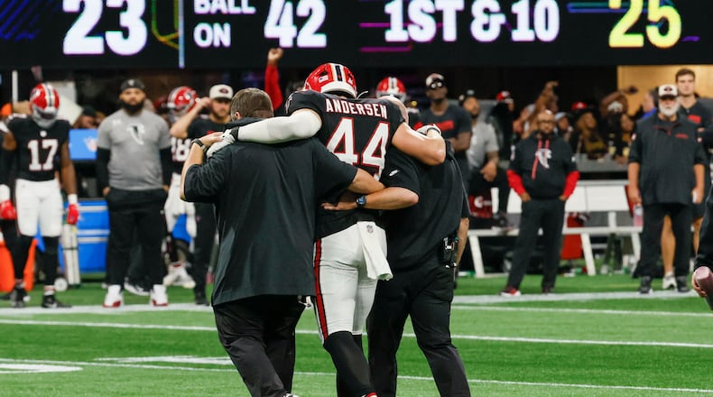 Atlanta Falcons linebacker Troy Andersen (44) is carryng out of the field by Falcons medical staff during the second half of an NFL football game against the New Orleans Saints on Sunday, Sept. 29, at Mercedes-Benz Stadium in Atlanta.
(Miguel Martinez/ AJC)
