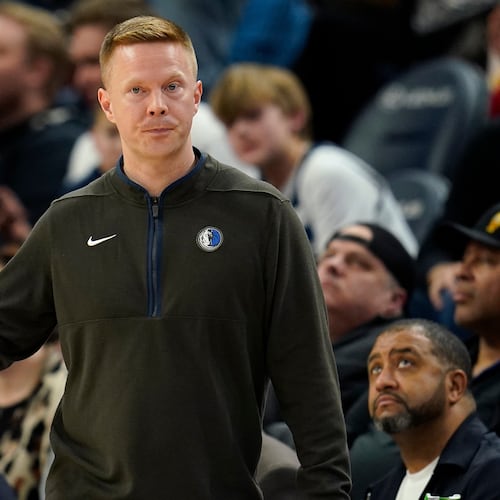 FILE - Dallas Mavericks assistant coach Sean Sweeney directs the team during the second half of an NBA basketball game against the Minnesota Timberwolves, Dec. 19, 2022, in Minneapolis. (AP Photo/Abbie Parr, File)