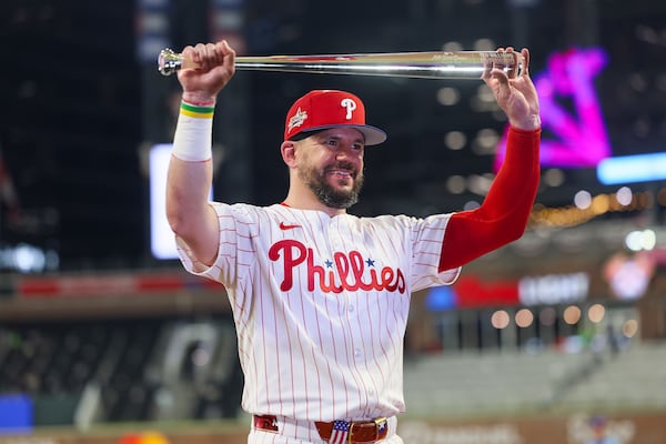 National League designated hitter Kyle Schwarber displays the MVP award after a home run to win the MLB All-Star Game against the American League at Truist Park on Tuesday, July 15, 2025, in Atlanta. (Jason Getz/AJC)