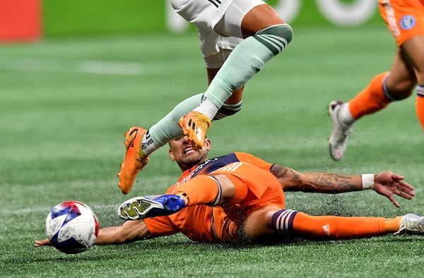 Soccer tackles aren’t like football tackles, but they can be pretty dramatic. (Hyosub Shin/AJC 2023)
