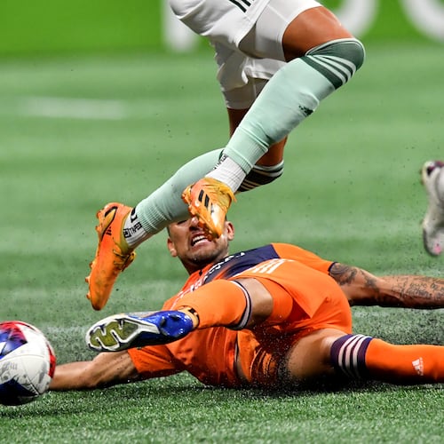 Soccer tackles aren’t like football tackles, but they can be pretty dramatic. (Hyosub Shin/AJC 2023)