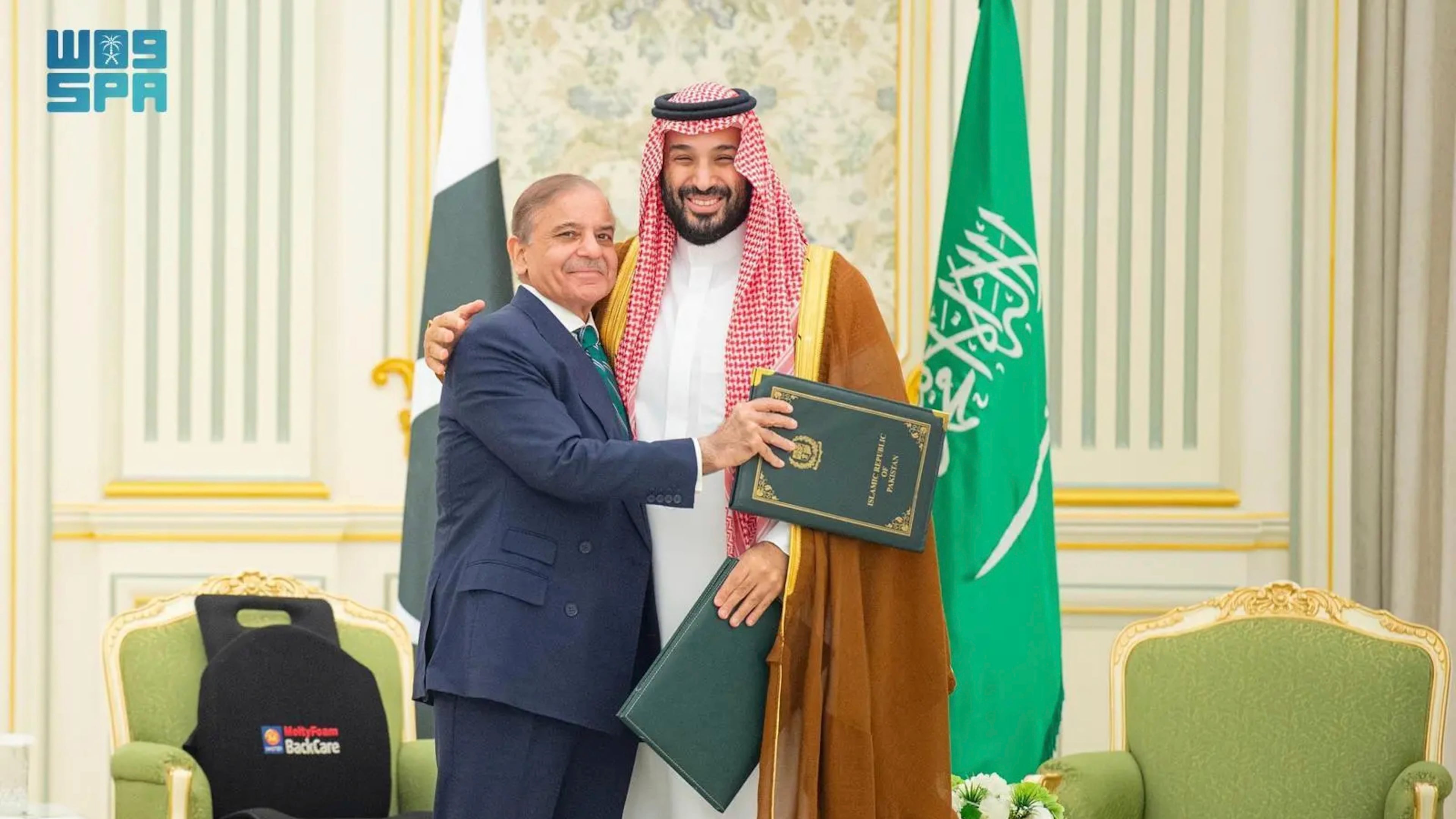 This handout photograph released by the state-run Saudi Press Agency shows Pakistani Prime Minister Shehbaz Sharif, left, embracing Saudi Arabia's Crown Prince Mohammed bin Salman after signing a joint defense pact in Riyadh, Saudi Arabia, Wednesday, Sept. 17, 2025. (Saudi Press Agency via AP)