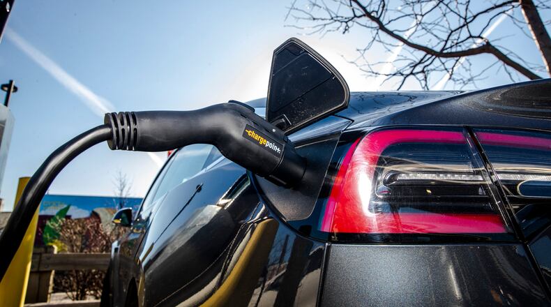 A charging station for electric vehicles in a parking lot at a Whole Foods in New York, March 9, 2020. The Biden administration announced new standards for federally-funded EV chargers Wednesday. (Brittainy Newman/The New York Times)