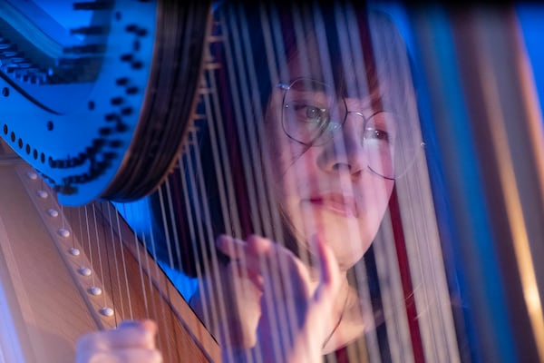 A member of the Vienna Symphony Orchestra plays on harp during "The Blue Danube" waltz as it is transmitted into deep space towards Voyager 1. in Vienna, Austria, on Saturday, May 31, 2025. (AP Photo/Denes Erdos)