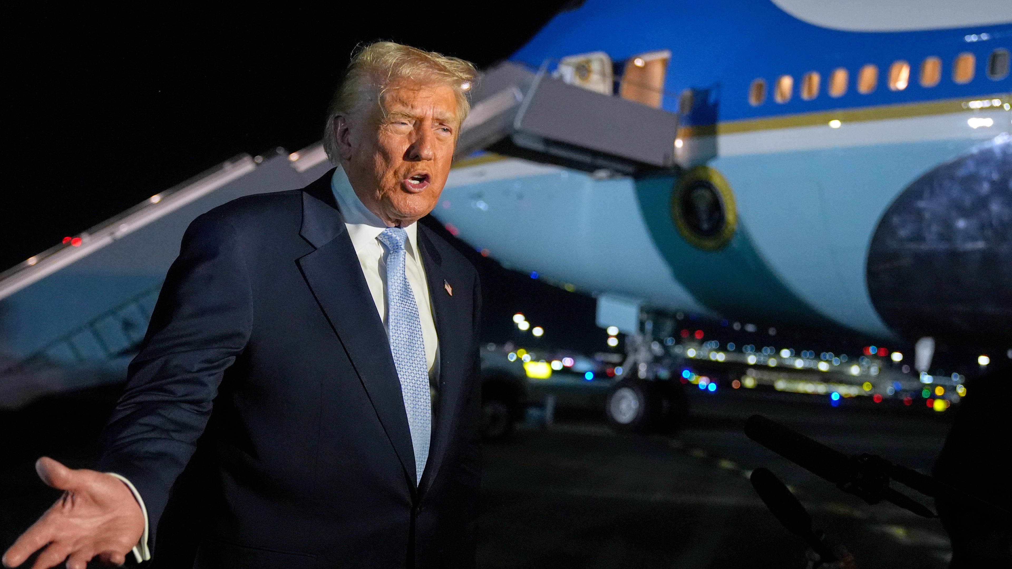 President Donald Trump speaks to reporters before boarding Air Force One at Palm Beach International Airport in West Palm Beach Fla., on his way back to the White House, Sunday, Nov. 16, 2025. (AP Photo/Manuel Balce Ceneta)