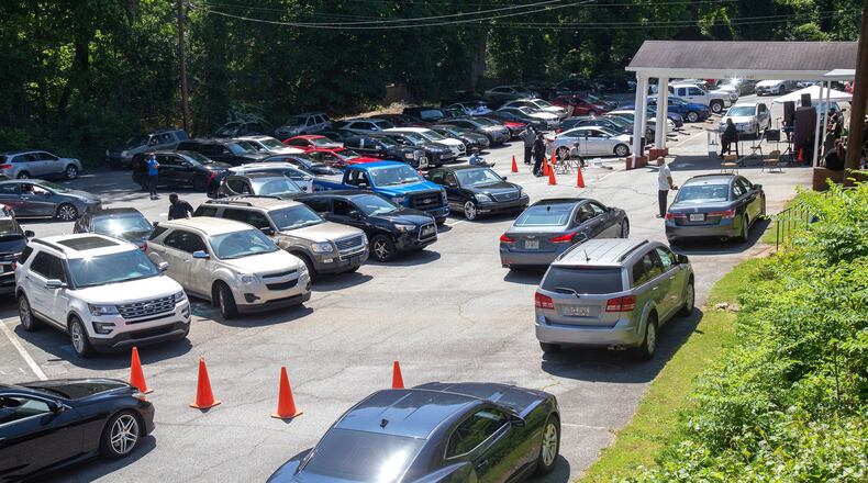 Cars fill the back parking lot of the New Beginning Full Gospel Baptist Church in Decatur during their drive-in Sunday service, May 3, 2020. STEVE SCHAEFER / SPECIAL TO THE AJC