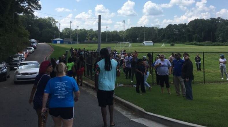 Parents picked up their children at a nearby soccer field after the lockdown at Campbell High School on Monday.