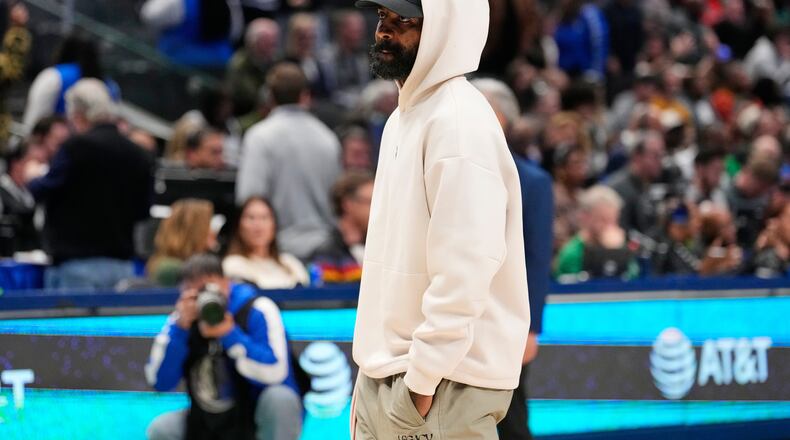 Dallas Mavericks guard Kyrie Irving stands on the court during a time ou in the second half of an NBA basketball game againt the Minnesota Timberwolves Wednesday, Jan. 28, 2026, in Dallas. (AP Photo/Tony Gutierrez)