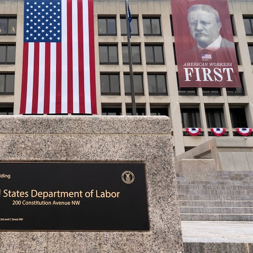 FILE - Portraits of Presidents Donald Trump and Theodore Roosevelt hang above the Department of Labor in Washington, July 7, 2026. (AP Photo/J. Scott Applewhite, File)