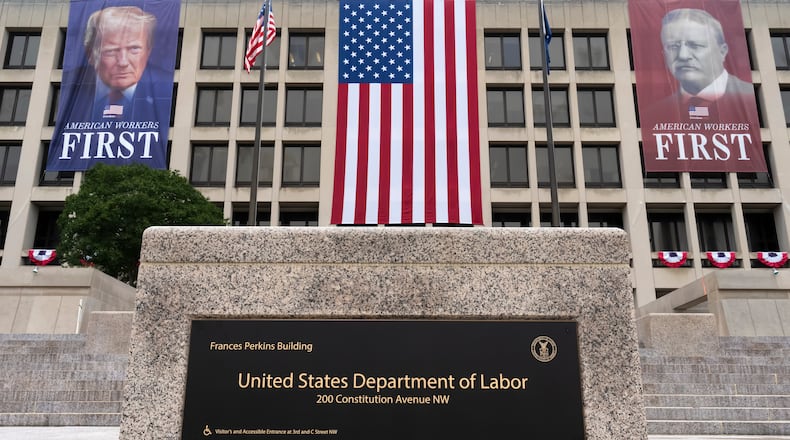 FILE - Portraits of Presidents Donald Trump and Theodore Roosevelt hang above the Department of Labor in Washington, July 7, 2026. (AP Photo/J. Scott Applewhite, File)