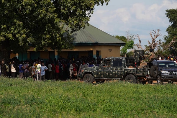 Soldiers stand guard prior to a visit from government officials following an attack by gunmen in Yelewata community north-central Nigeria, Monday, June 16, 2025. (AP Photo)