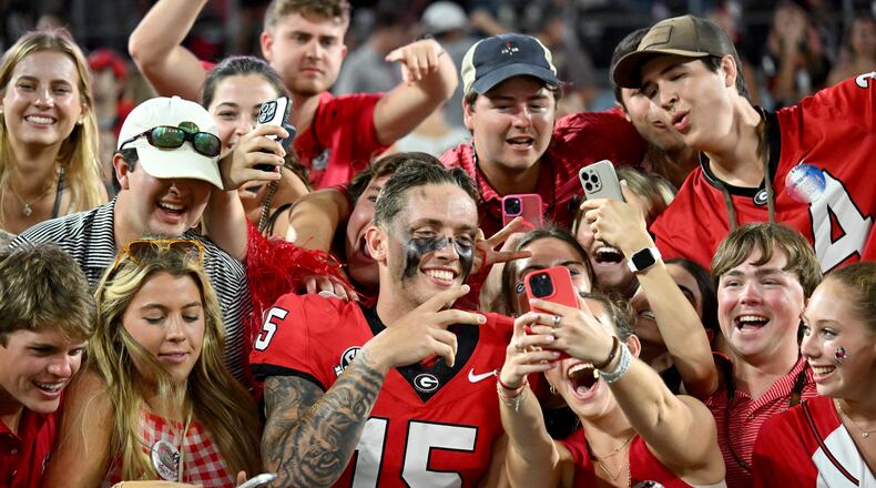 Georgia quarterback Carson Beck (15) celebrates with fans after Georgia beat Florida 34-20 during the NCAA football game at EverBank Stadium on Saturday, Nov. 2, 2024, in Jacksonville, Fla. (Hyosub Shin/AJC)