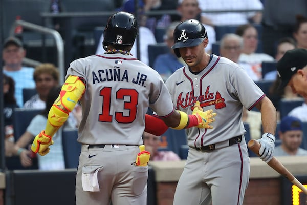 Braves right fielder Ronald Acuña Jr. (left) celebrates his third-inning home run with teammate Matt Olson.
