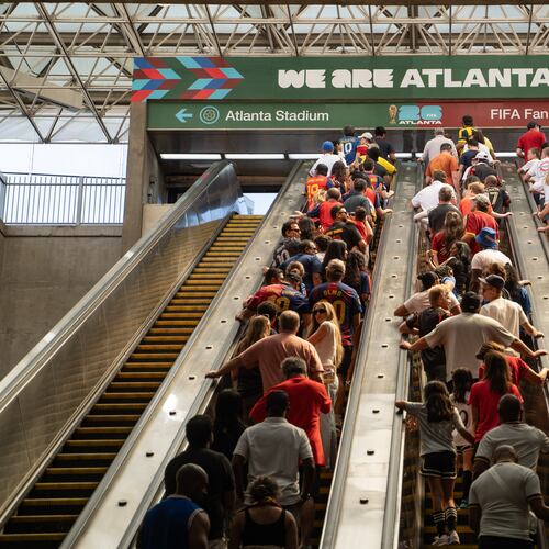 Fans ride the escalators inside the SEC District MARTA station to attend the first FIFA World Cup match in Atlanta, on June 15, 2026. (Ben Hendren for the AJC)