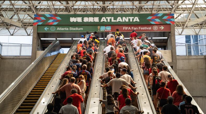 Fans ride the escalators inside the SEC District MARTA station to attend the first FIFA World Cup match in Atlanta, on June 15, 2026. (Ben Hendren for the AJC)
