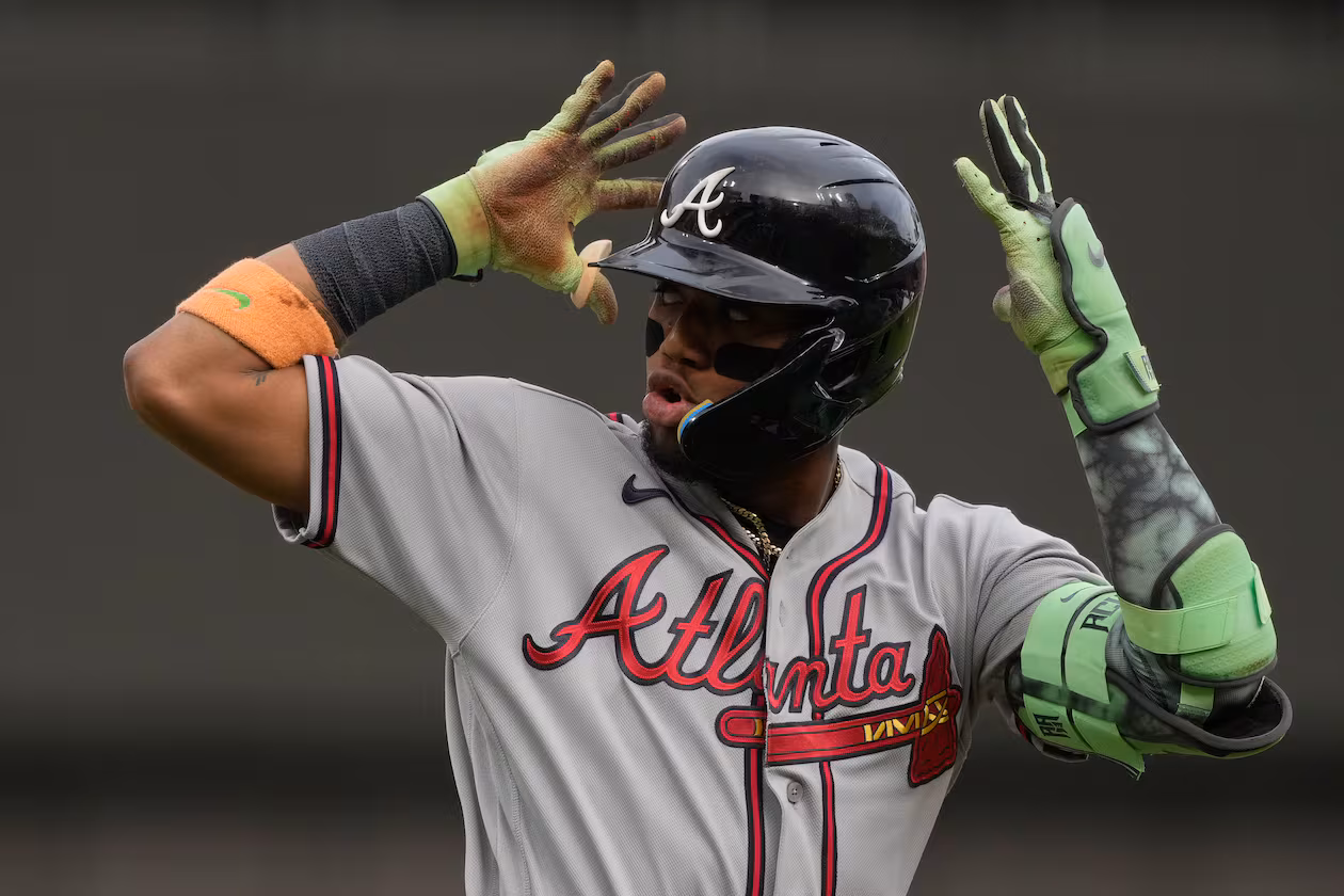 Atlanta Braves right fielder Ronald Acuña Jr. reacts as he round third base after hitting a solo home run during the first inning of a baseball game against the Cincinnati Reds in Cincinnati, Friday, May 29, 2026. (AP Photo/Carolyn Kaster)