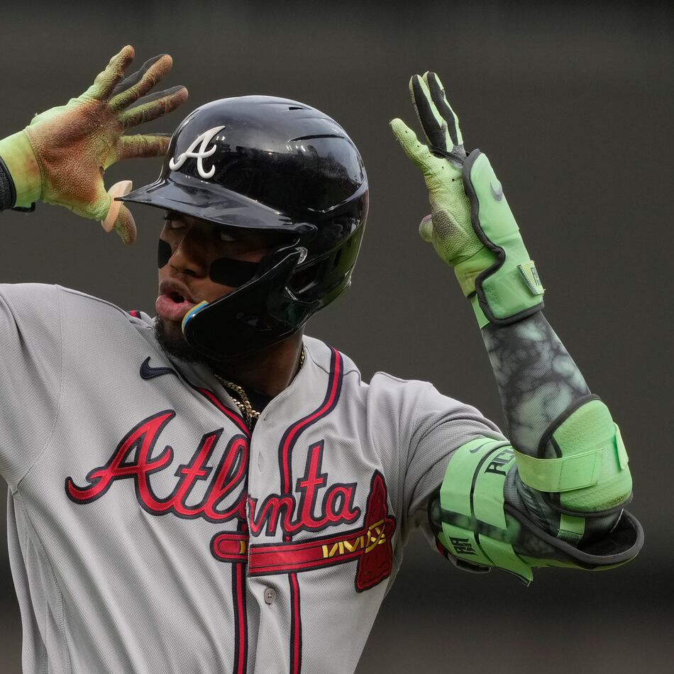 Atlanta Braves right fielder Ronald Acuña Jr. reacts as he round third base after hitting a solo home run during the first inning of a baseball game against the Cincinnati Reds in Cincinnati, Friday, May 29, 2026. (AP Photo/Carolyn Kaster)