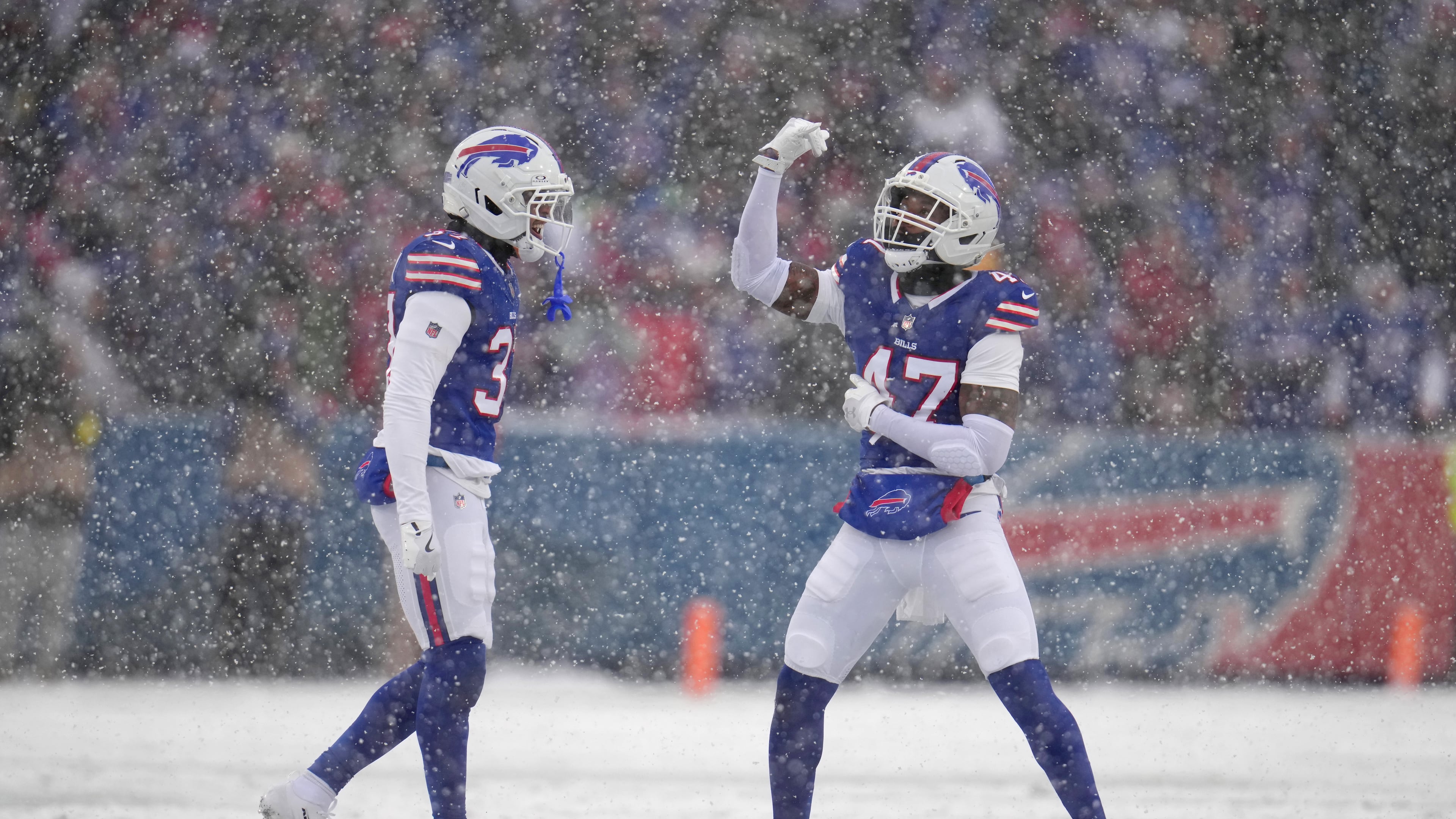 Buffalo Bills cornerback Christian Benford (47) celebrates sacking Cincinnati Bengals quarterback Joe Burrow with teammate cornerback Jordan Hancock (37) during the first half of an NFL football game, Sunday, Dec. 7, 2025, in Orchard Park, N.Y. (AP Photo/Gene J. Puskar)