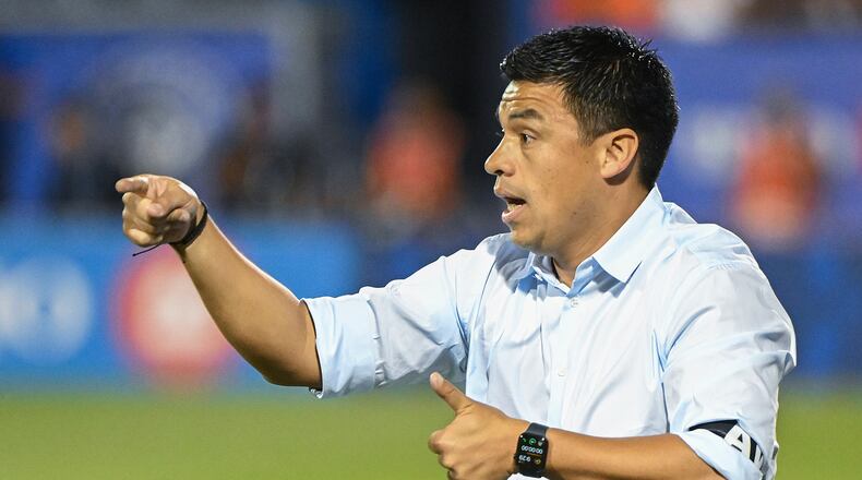 Atlanta United manager Gonzalo Pineda gives instruction from the sideline during MLS soccer match action against CF Montreal in Montreal, Saturday, July 8, 2023. (Graham Hughes/The Canadian Press via AP)