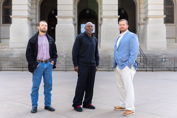 Lee Clark, from left, Terry Talley and Joey Watkins were all men wrongfully convicted and served more than 20 years in prison before being exonerated. They visited the Capitol earlier this month to drum up support for bills that would compensate them for the years lost. (Arvin Temkar/AJC)