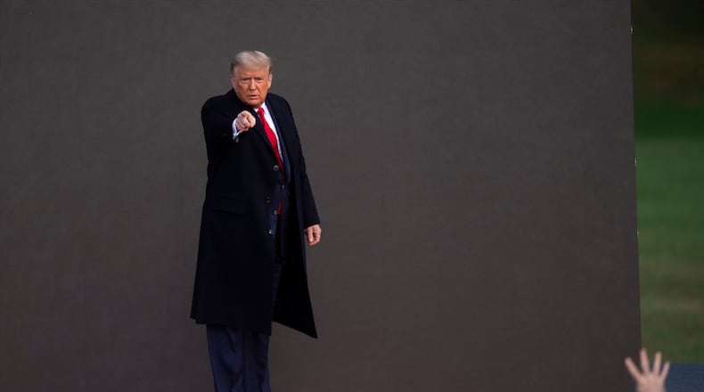 President Donald Trump acknowledges supporters after holding a campaign rally on Satruday, Oct. 31, 2020, in Newtown, Pennsylvania. With the election only three days away, Trump planned four rallies across Pennsylvania Satuday, as he vies to recapture the Keystone State's vital 20 electoral votes. In 2016, he carried Pennsylvania by only 44,292 votes out of more than 6 million cast, less than a 1 percent differential, becoming the first Republican to claim victory here since 1988. (Mark Makela/Getty Images/TNS)
