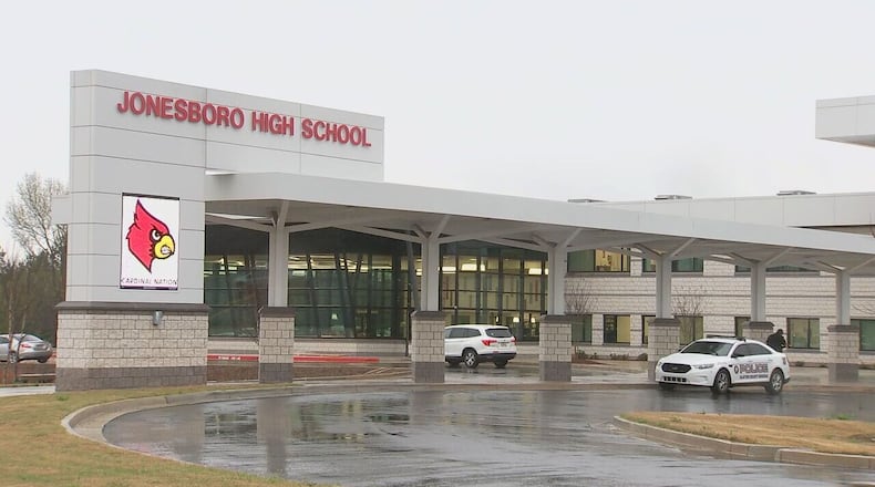 Clayton County Schools investigating educator alleged to have removed his shirt at school.