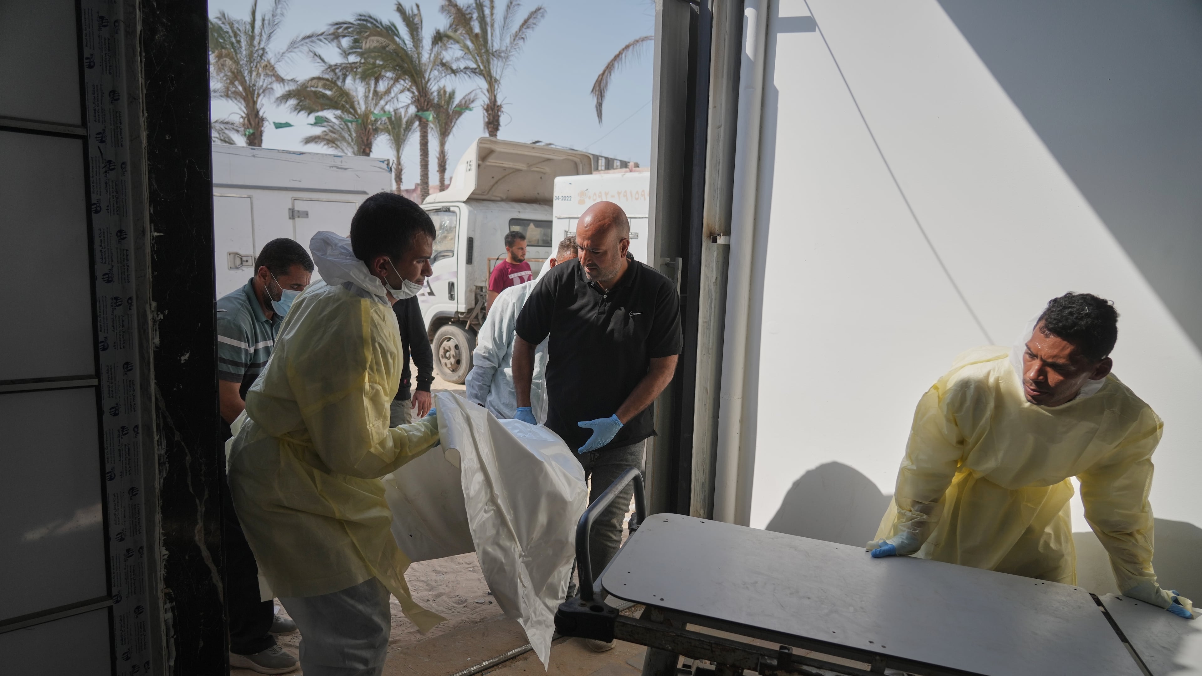 Bodies of unidentified Palestinians returned from Israel as part of the ceasefire deal are brought to Nasser Hospital in Khan Younis, Gaza Strip, Wednesday Nov. 5, 2025. (AP Photo/Jehad Alshrafi)