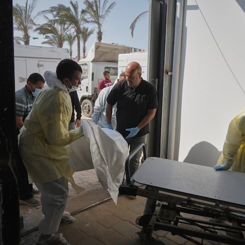Bodies of unidentified Palestinians returned from Israel as part of the ceasefire deal are brought to Nasser Hospital in Khan Younis, Gaza Strip, Wednesday Nov. 5, 2025. (AP Photo/Jehad Alshrafi)