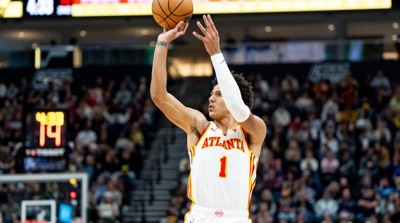 Atlanta Hawks forward Jalen Johnson (1) shoots during the first half of an NBA basketball game against the Utah Jazz, Friday, March 15, 2024, in Salt Lake City. (AP Photo/Spenser Heaps)
