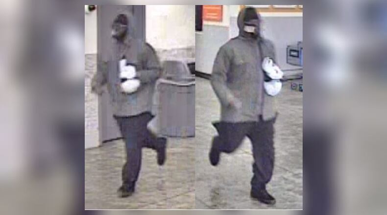 Police said a man caught on surveillance footage robbed a Walmart in Marietta and ran away Friday. An hours-long standoff ensued when an officer pulled over a driver who they said matched the description of the robber.