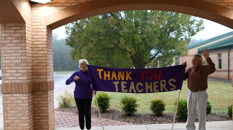 Carol and Barry Walton, grandparents of three students at Kedron Elementary in Peachtree City, created a banner that showed appreciation for the school's teachers.