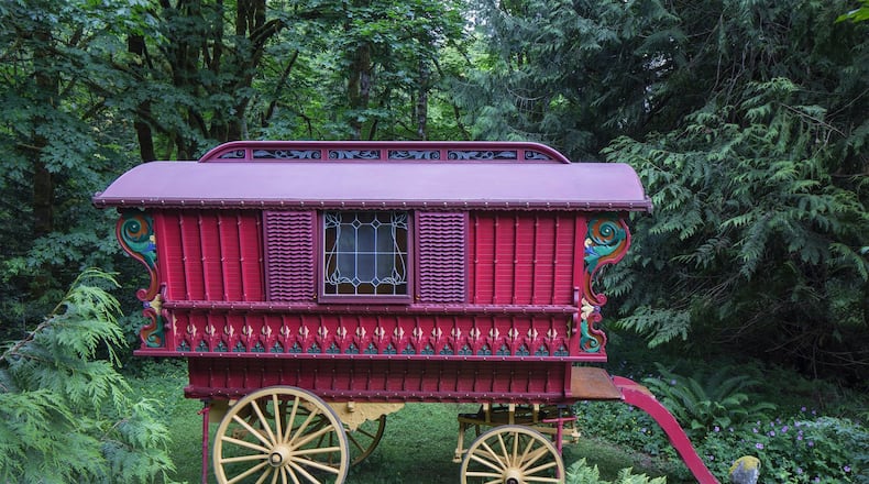 A yellow undercarriage with spoked wheels supports this 13-foot-long Ledge wagon, which Denise Harris built by hand using drawings from the book Making Model Gypsy Caravans. (Steve Ringman/Seattle Times/TNS)