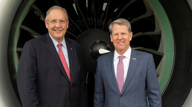 Gregory J. Hayes (left), the chairman and chief executive officer of Raytheon Technologies, and Gov. Brian Kemp posed in front of a Pratt & Whitney GTF engine displayed at the entrance of the RTX pavilion at the Paris Air Show 2023, Le Bourget Airport, Paris, France, on June 20, 2023. (Alex MacNaughton for Raytheon Technologies)