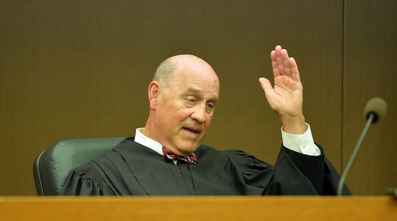 Fulton County Superior Court Judge Jerry Baxter says "Adios" following a re-sentencing hearing in Fulton County Superior Court, Thursday, April 30, 2015. Former regional directors Tamara Cotman, Sharon Davis-Williams and Michael Pitts were given the heftiest punishment — 20 years, seven years to be served in prison and 13 years on probation following their convictions racketeering and other charges in the Atlanta Public Schools test-cheating trial. Fulton County Superior Court Judge Jerry Baxter resentenced the trio to 3 years in prison, 7 years probation, $10,000 fine and 2000 hours of community service. (Atlanta Journal-Constitution, Kent D. Johnson, Pool)