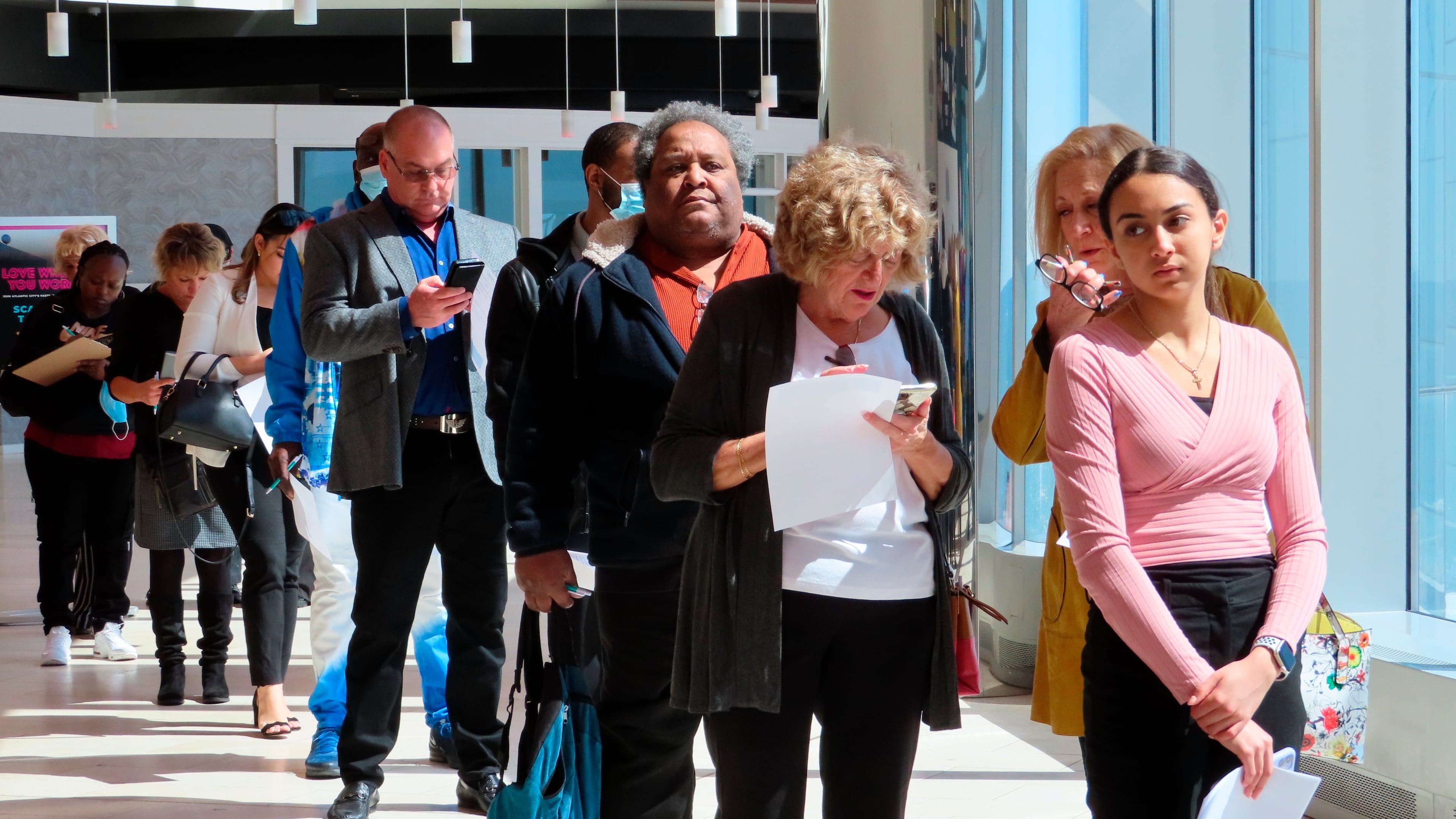 FILE - Applicants line up at a job fair at the Ocean Casino Resort in Atlantic City N.J., on April 11, 2022. (AP Photo/Wayne Parry, File)
