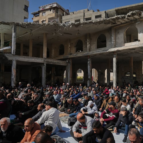 Muslim worshippers gather for Friday prayer during the holy fasting month of Ramadan at the Alkanz Mosque, which was damaged during the Israel–Hamas war, in Gaza City, Friday, Feb. 20, 2026. (AP Photo/Jehad Alshrafi)